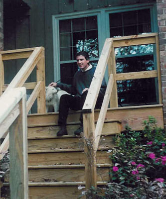 [Charlie with Snowy the dog on his cousin Caroline Peytons porch in 1996]