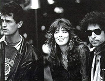 [An unlikely trio: Rupert Everett, Fiona, and Dylan on the set of Hearts of Fire