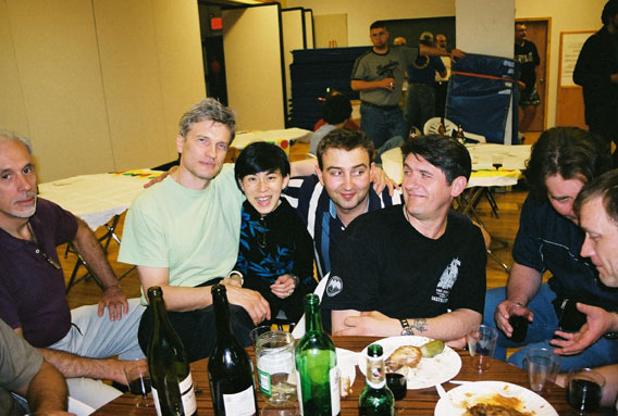 [Edgar Cakuls, Peggy Chau (owner of Fighthouse), instructor Denis Dmitriev and Vladimir Vasiliev at a Fighthouse party in June 2006]