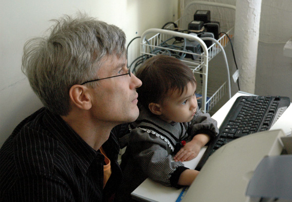 [Edgar and Sophia Dmitriev hard at work on the computer]