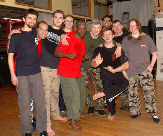 [Fighthouse instructors Edgar Cakuls (left) and Frank Fileti (center), with me at a Fighthouse party in June 2006.]