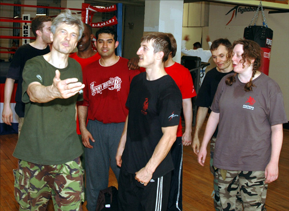 [Fighthouse instructors Edgars Cakuls (left) and Frank Fileti (center), with me at a Fighthouse party in June 2006.]